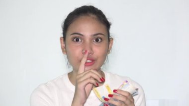 Philippine Woman Counting Foreign Money Isolated