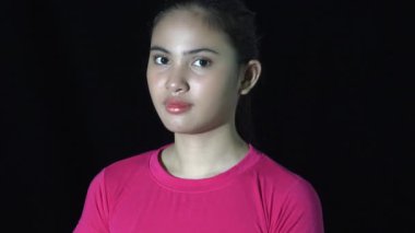 A Serious Asian Woman In Darkness