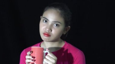 A Sad Asian Woman Drinking Coffee