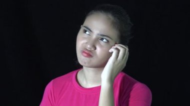 Confused Asian Woman Thinking In Darkness