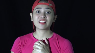 A Diverse Sporty Asian Woman Talking