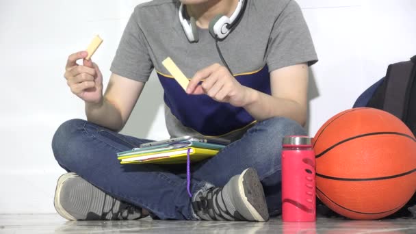 College Student Eating Snacks Isolated — Vídeo de stock