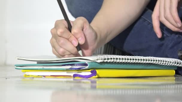 Person Writing Notebooks — Stock video