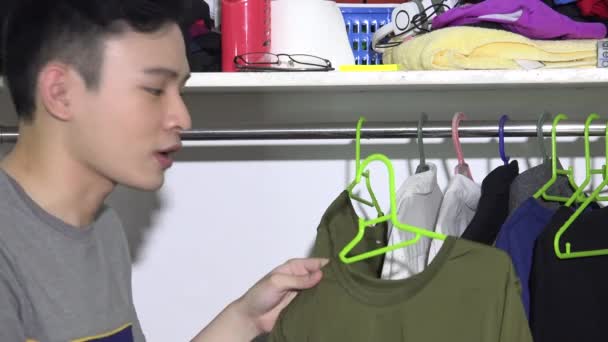 Asian Man Clothes Closet — Stock Video