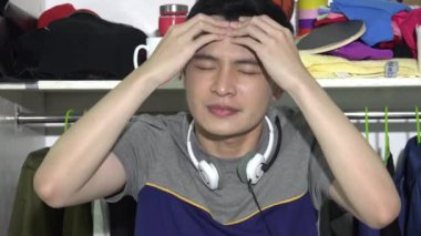 Stressed Man In Front Of Closet