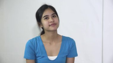A Content Female Asian Woman Isolated