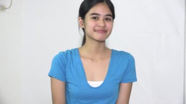 Flirty Female Asian Woman Winking Isolated
