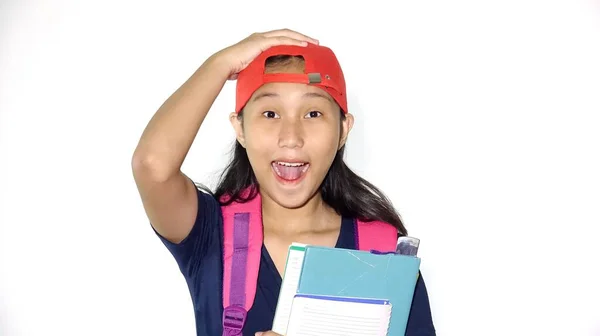 Sorprendida Asiática Estudiante Sosteniendo Libros Aislado — Foto de Stock