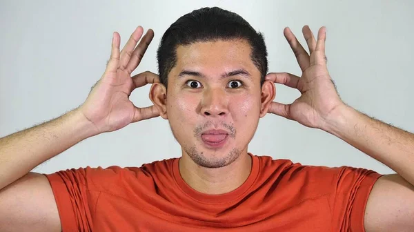 An Asian Man Making Funny Faces