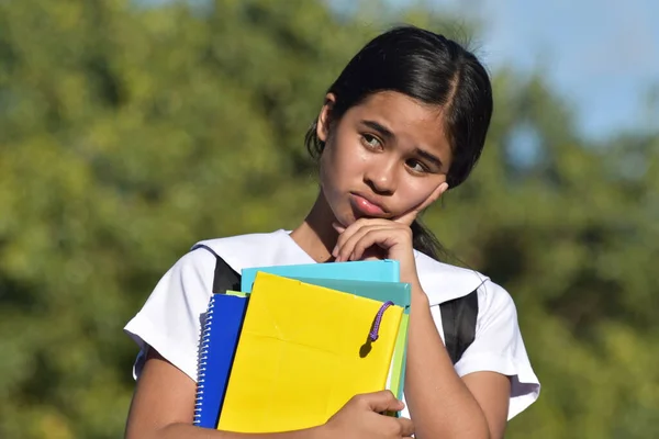 Pretty Asian Female Student Thinking Wearing School Uniform Holding Books