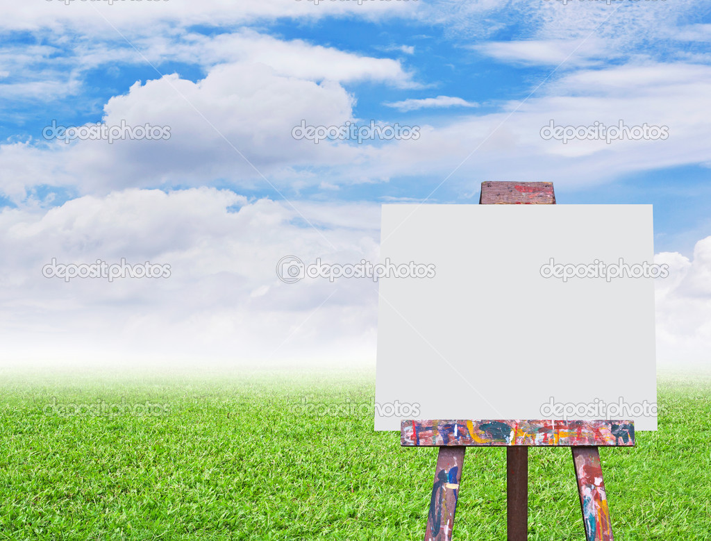 Easel with empty canvas on nature background