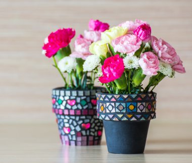 Carnation in mosaic flower pot clipart