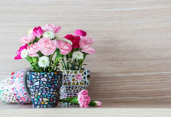 Carnation in mosaic flower pot — Stock Photo, Image