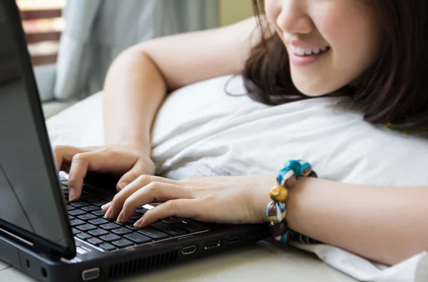 Asian woman playing with laptop — Stock Photo, Image