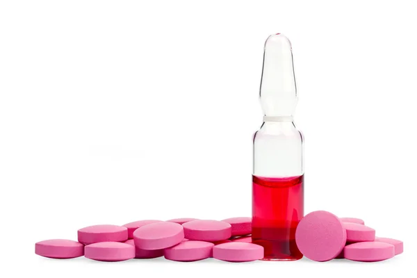 Red ampule and pink pills — Stock Photo, Image