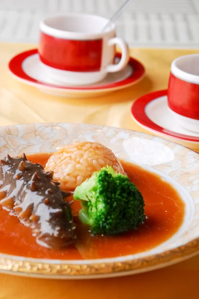 Chinese food sea cucumber and rice — Stock Photo, Image