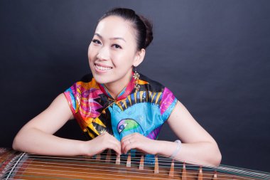 Girl and Chinese zither clipart