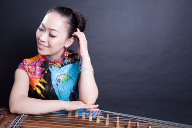 Girl and Chinese zither clipart