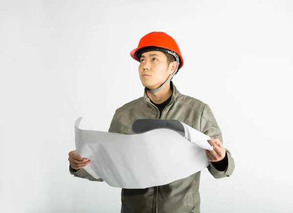 Male construction worker and sketching blueprints — Stock Photo, Image