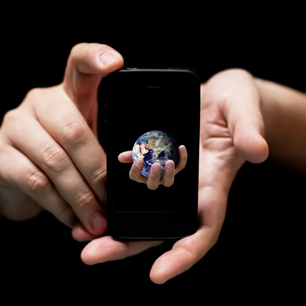 El mundo en tus manos, smartphone — Foto de Stock