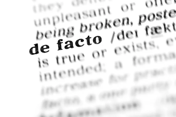 De facto słownika słowo — Zdjęcie stockowe