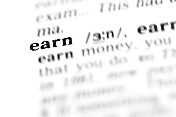 Earn word dictionary — Stock Photo, Image