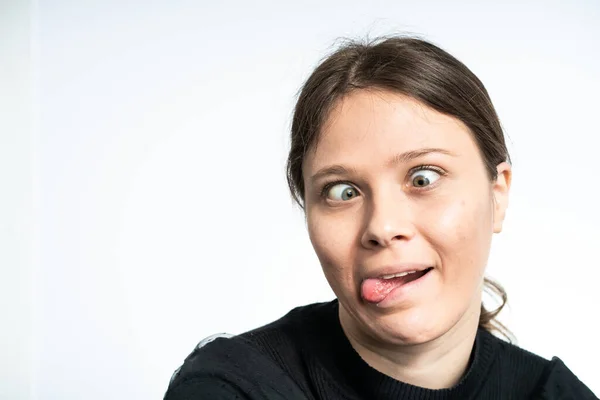 Happy Young Woman Making Funny Faces Wearing Black White Background — 图库照片