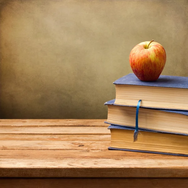 Background with vintage books and apple. — Stock Photo, Image