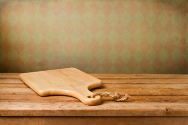 Background with cutting board on wooden table