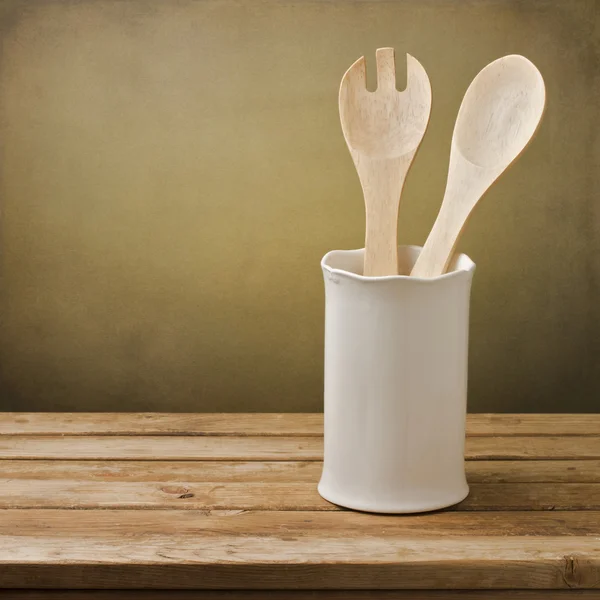 Kitchen utensils on wooden table — Stock Photo, Image
