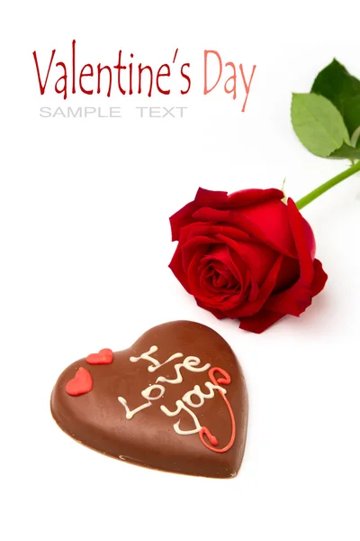 Valentine's Day concept. Heart shape chocolate and red rose on white background — Stock Photo, Image