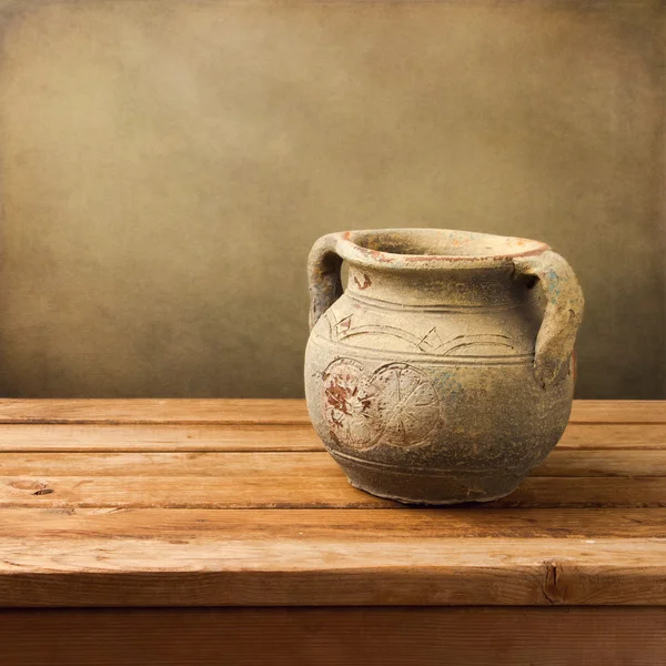 Vintage ceramic jug on wooden table — Stock Photo, Image