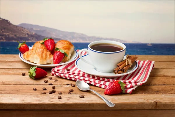 Beautiful breakfast arrangement on wooden table — Stock Photo, Image