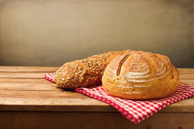 Fresh bread on tablecloth