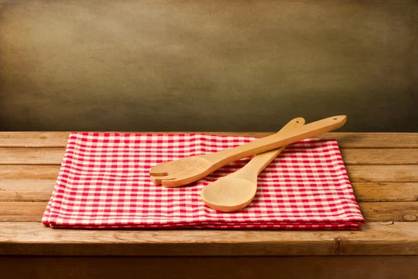 Background with kitchen utensils on tablecloth — Stock Photo, Image