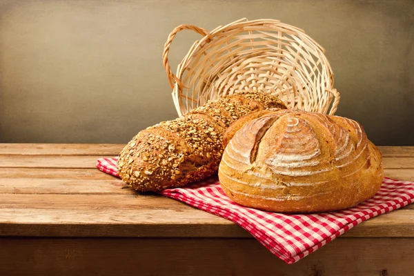 Fresh bread on wooden vintage table — Stock Photo, Image