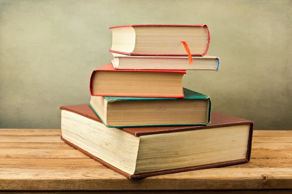 Vintage old books on wooden deck table — Stock Photo, Image