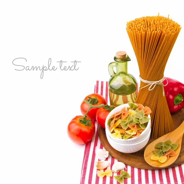 Italian pasta with vegetables on striped tablecloth — Stock Photo, Image