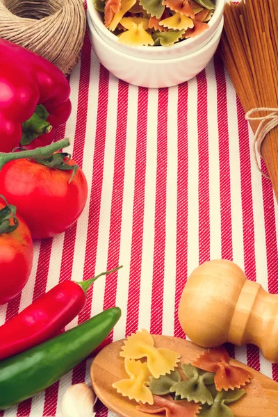 Background with striped tablecloth and raw food — Stock Photo, Image