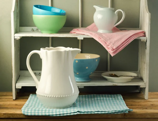 Still life with tableware on vintage shelf — Stock Photo, Image