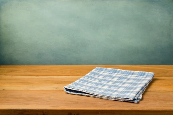 Wooden table with tablecloth — Stock Photo, Image