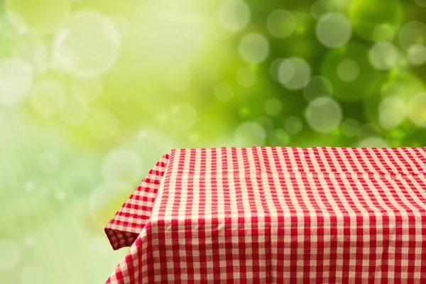 Empty table with red checked tablecloth — Stock Photo, Image