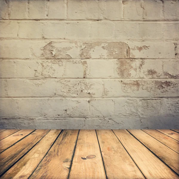 Wooden deck floor and stone grunge wall — Stock Photo, Image