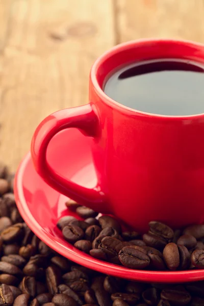 Közelkép a kávé csésze kávé babbal — Stock Fotó
