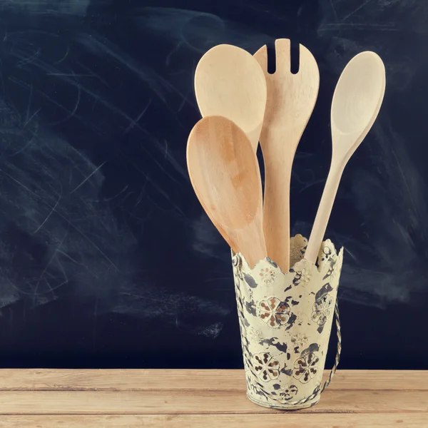 Kitchen wooden utensils in retro bucket — Stock Photo, Image