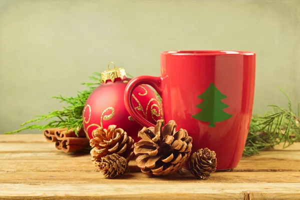 Christmas mug with pine corns — Stock Photo, Image