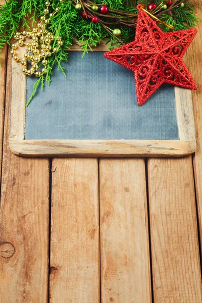 Christmas background with chalkboard — Stock Photo, Image