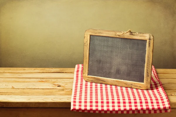 Chalkboard and tablecloth — Stock Photo, Image