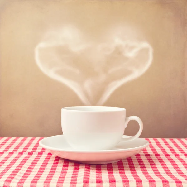 Coffee cup with heart shape steam — Stock Photo, Image