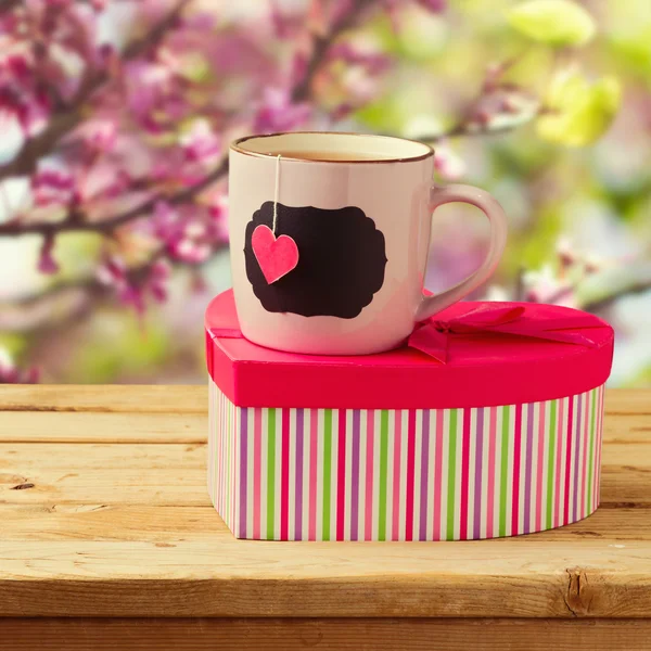 Cup of tea with heart shape and gift box — Stock Photo, Image